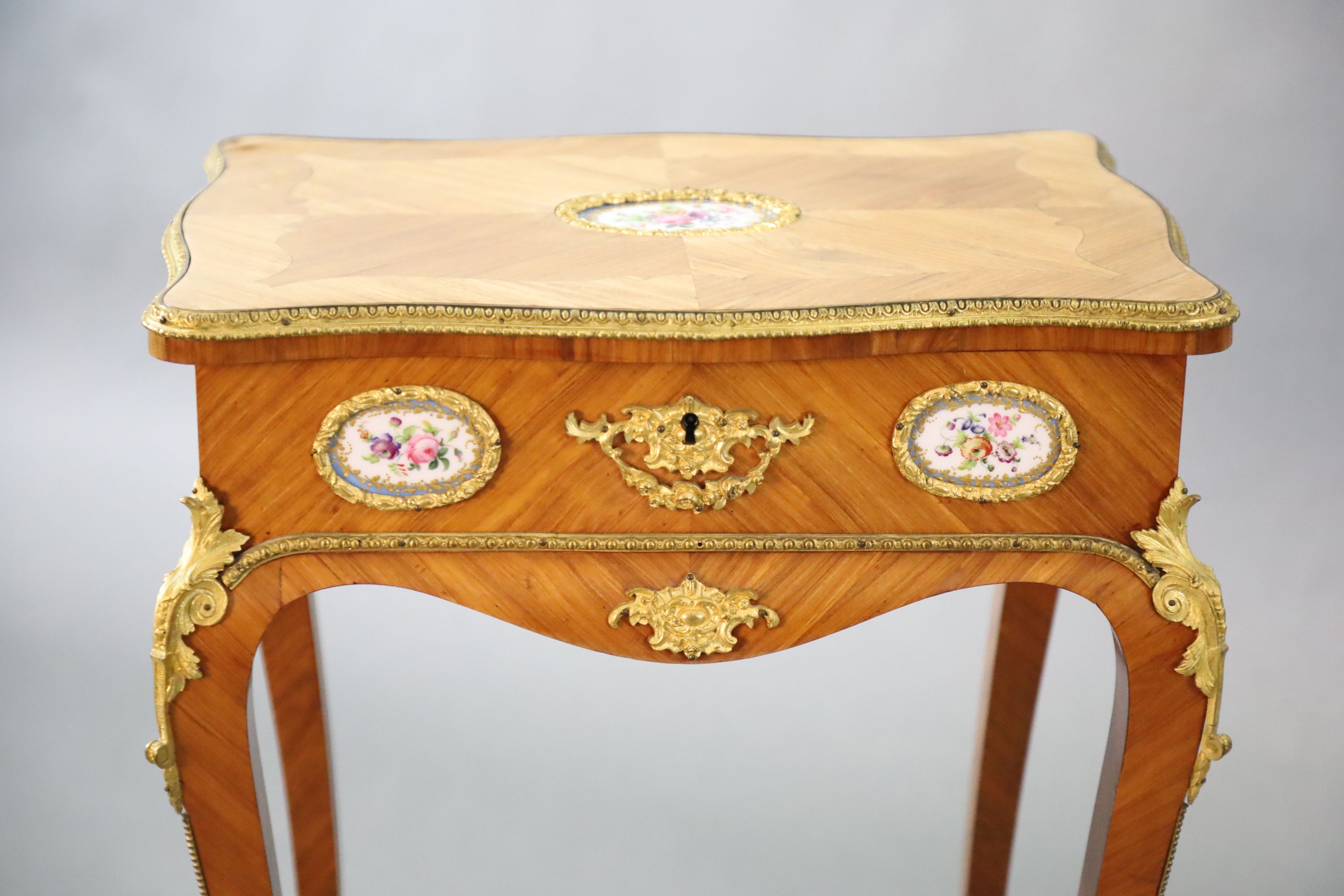 A late 19th century French Louis XV style ormolu kingwood work table, W.1ft 8in. D.1ft 2.5in. H.2ft 3in.